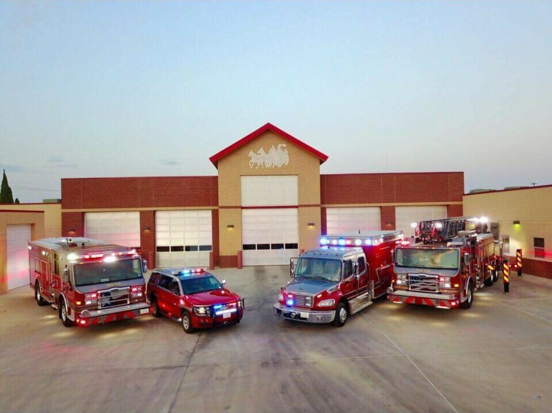 Odessa Fire Rescue engines and ambulances lined up in front of a fire station